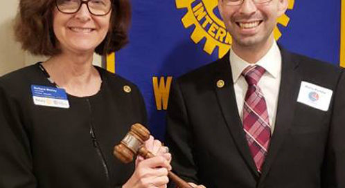Mario Portillo passed the gavel to Barbara Worley during the installation ceremony.